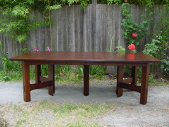 Table shown open with four leaves.  Measures 8' long. 